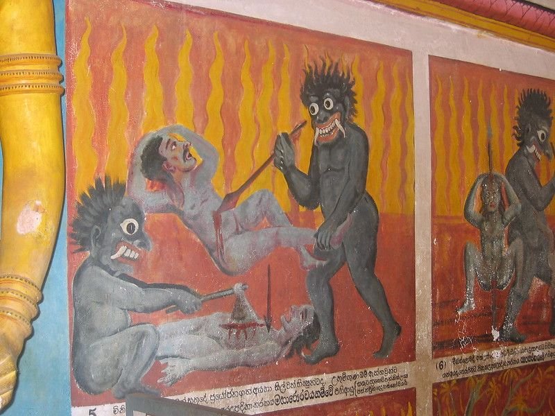 The hell cave. Demons sawing, boiling and dismembering — painted to be understood by people who could not read, which is the whole point of this place in reverse.