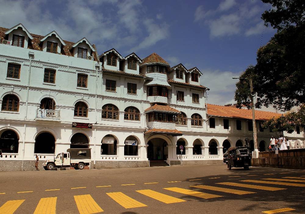 Queen’s Hotel at the end of the main street, on the Perahera route since 1869.
